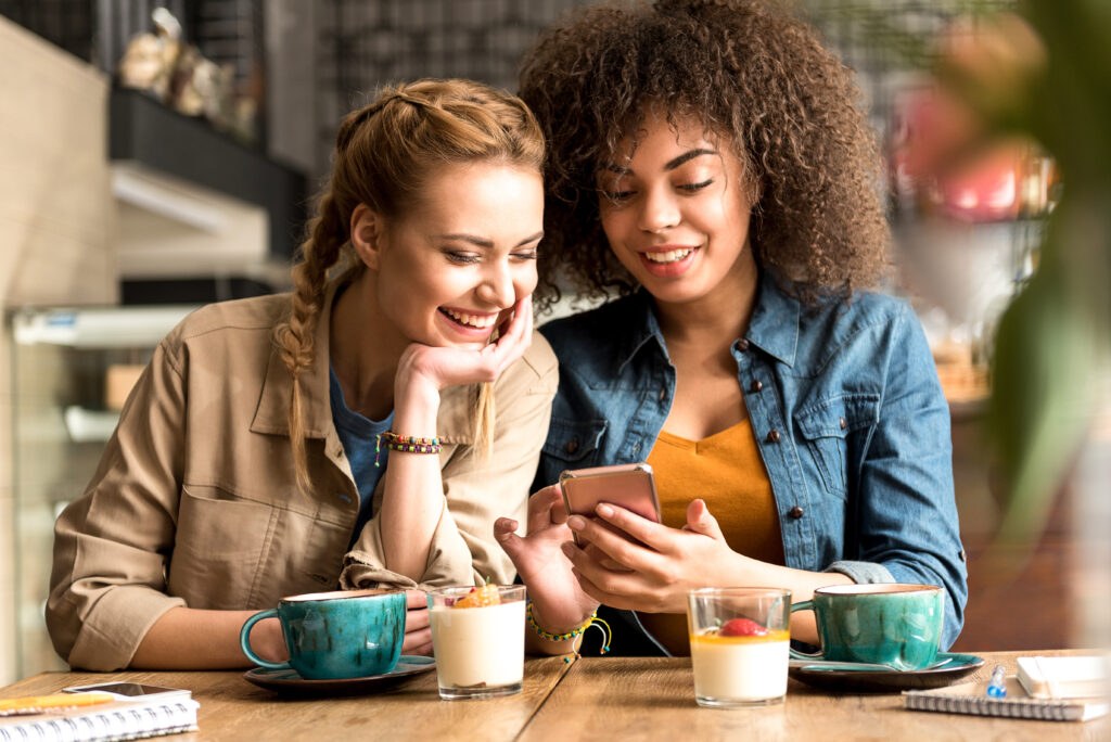 Smiling woman telling with beaming female