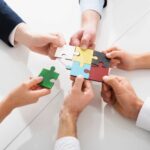 Teamwork of partners. Concept of integration and startup with puzzle pieces